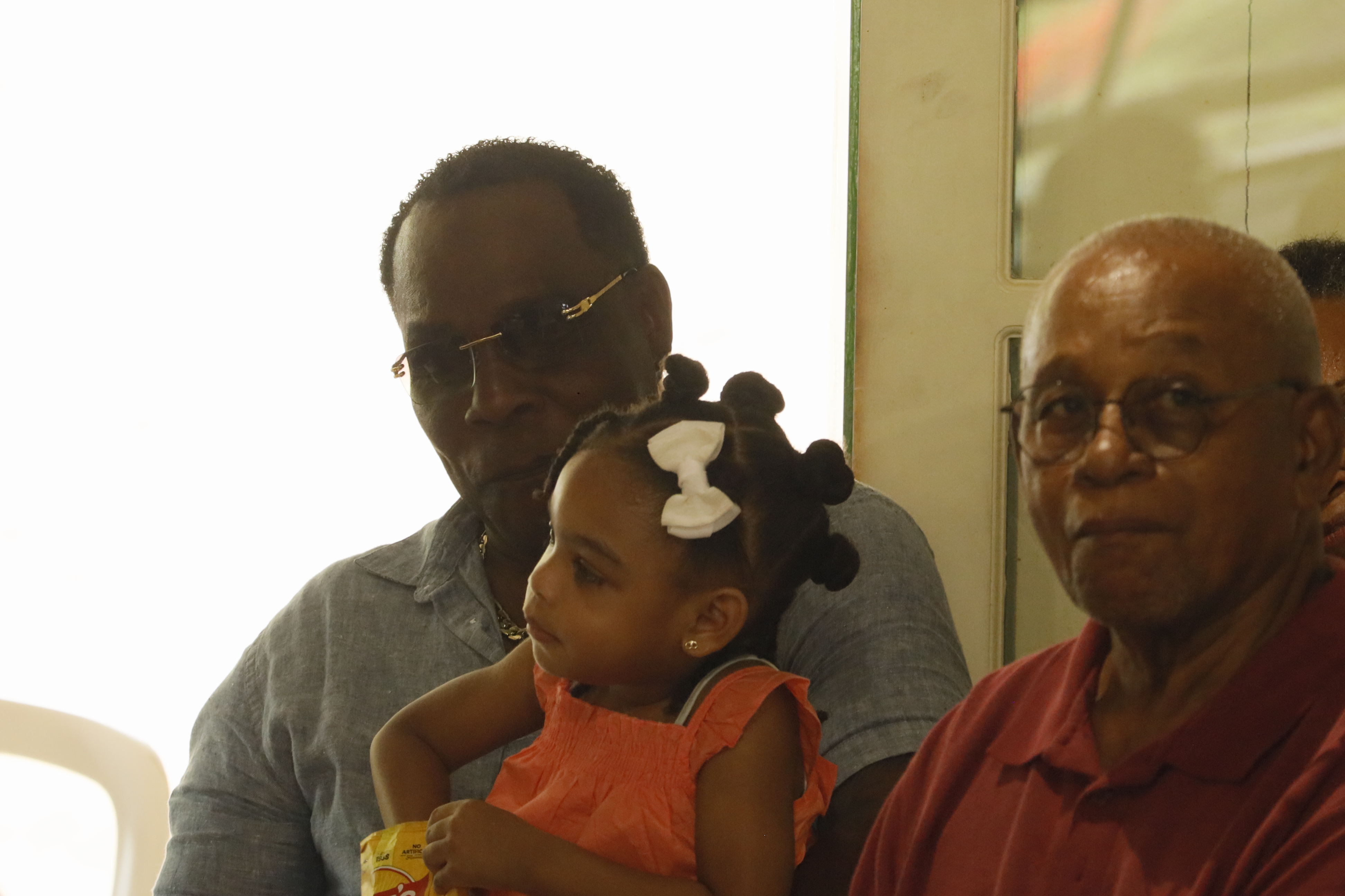 Man and child attending the book launch