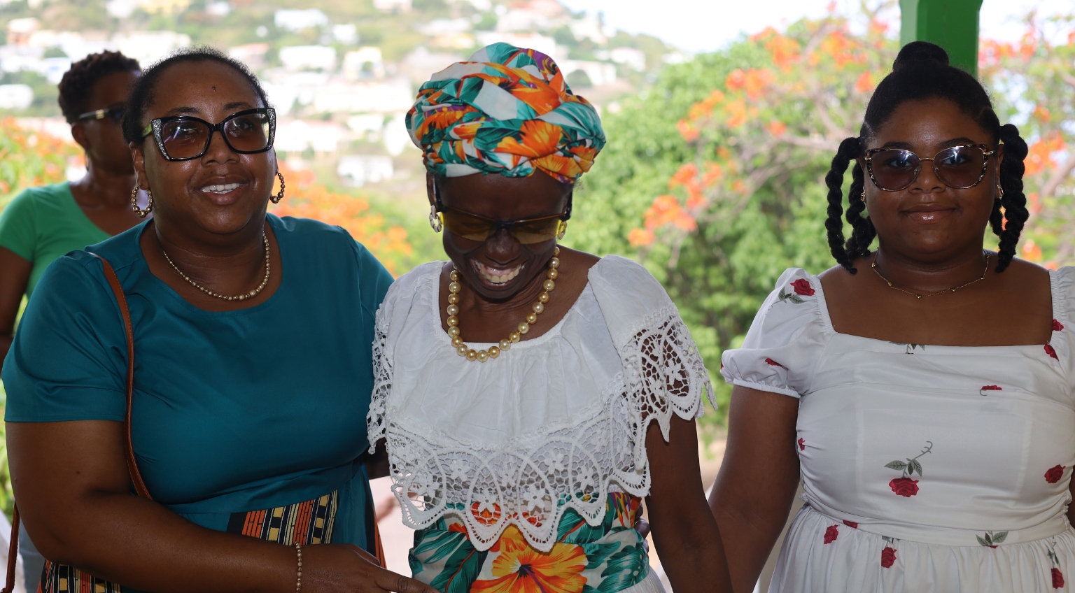 A joyful Bernadetta Davis embraced by daughter Catherine Nicholas and granddaughter