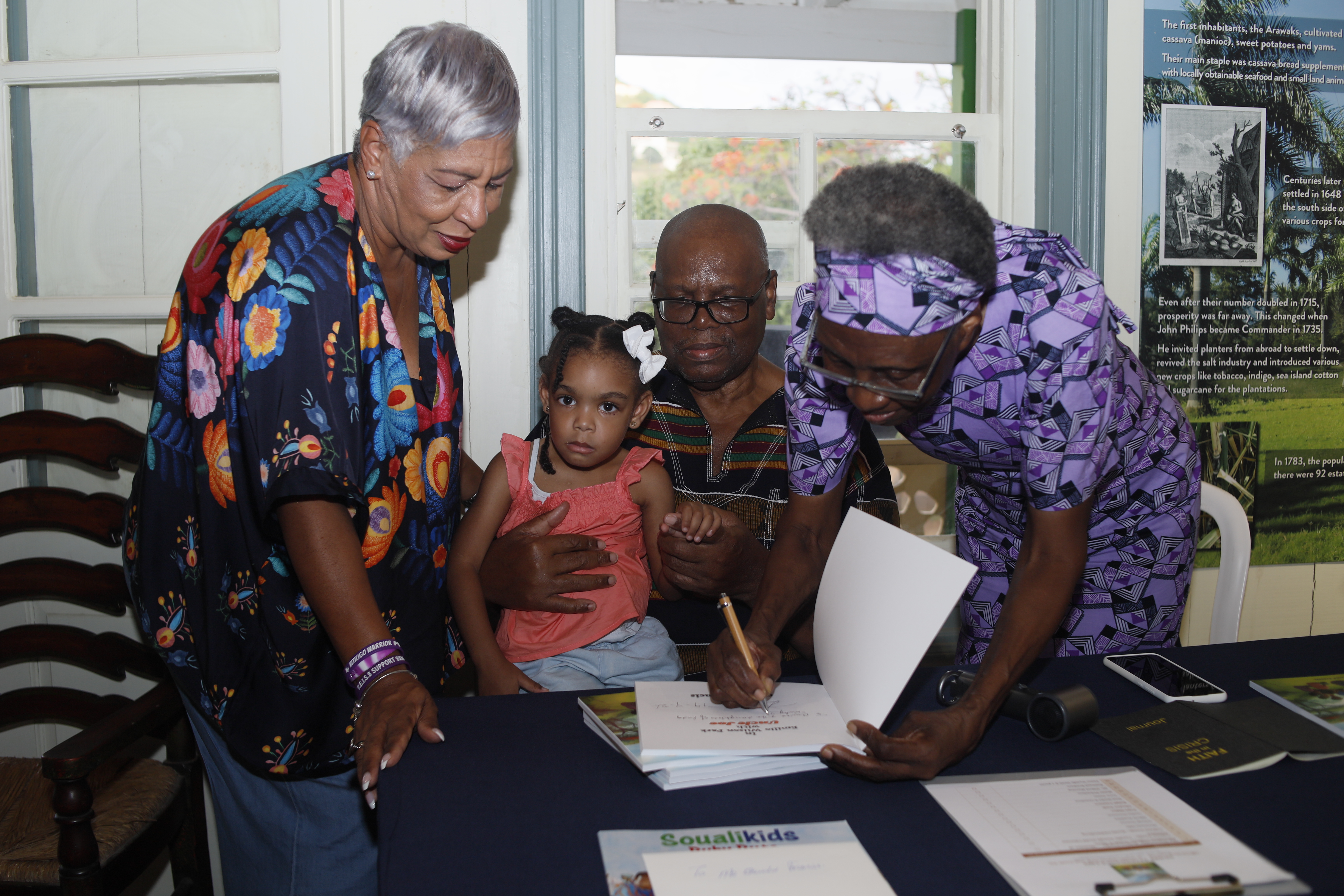 Author Oswald Francis and Kathleen Francis signing books