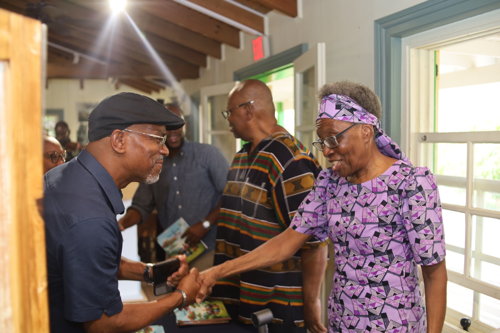 Rolando Tobias warmly greeting Mrs. Kathleen Francis