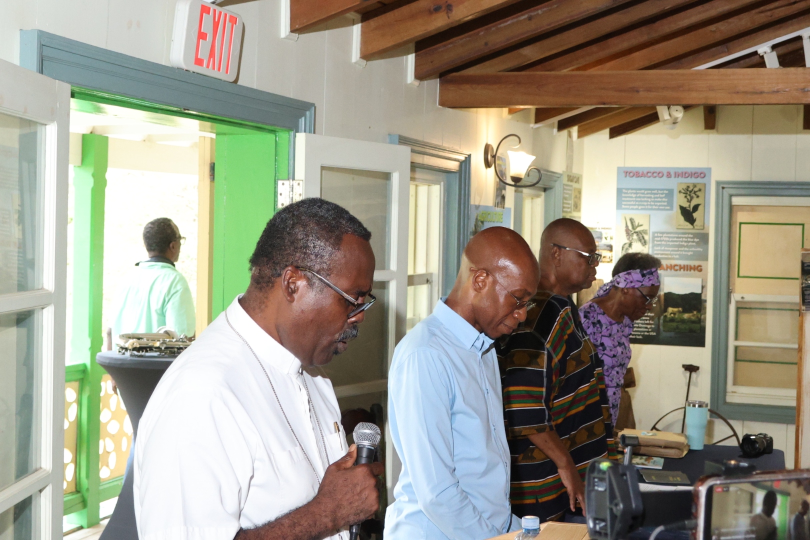 Rev. Patmore C. Henry delivering the opening prayer