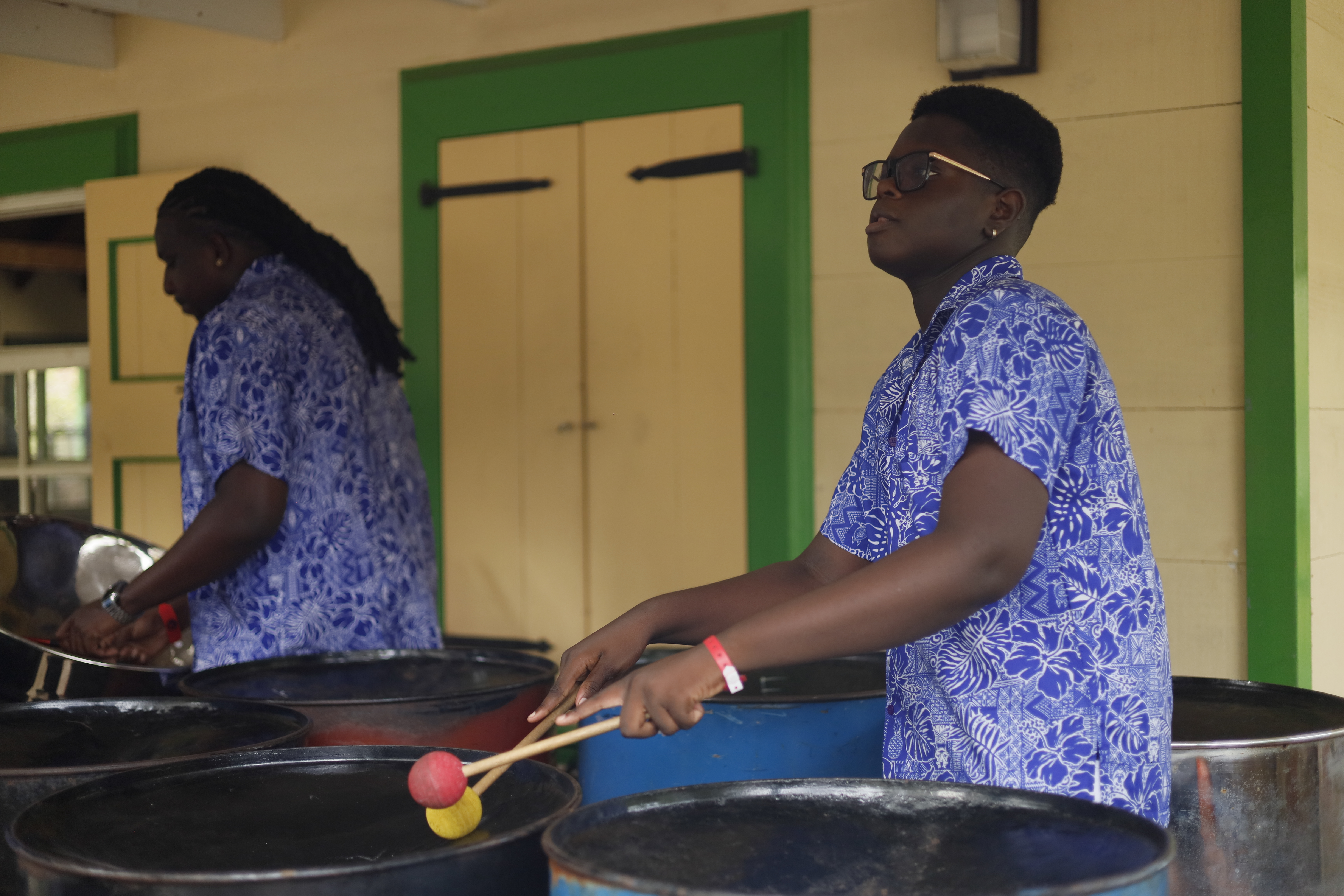 Steel pan band performing indoors
