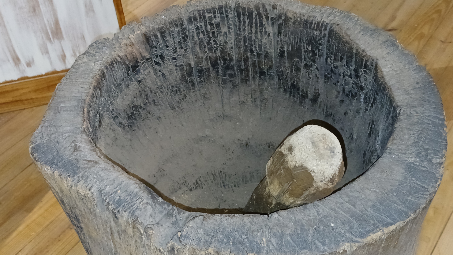Traditional wooden mortar and pestle at the Emilio Wilson Museum